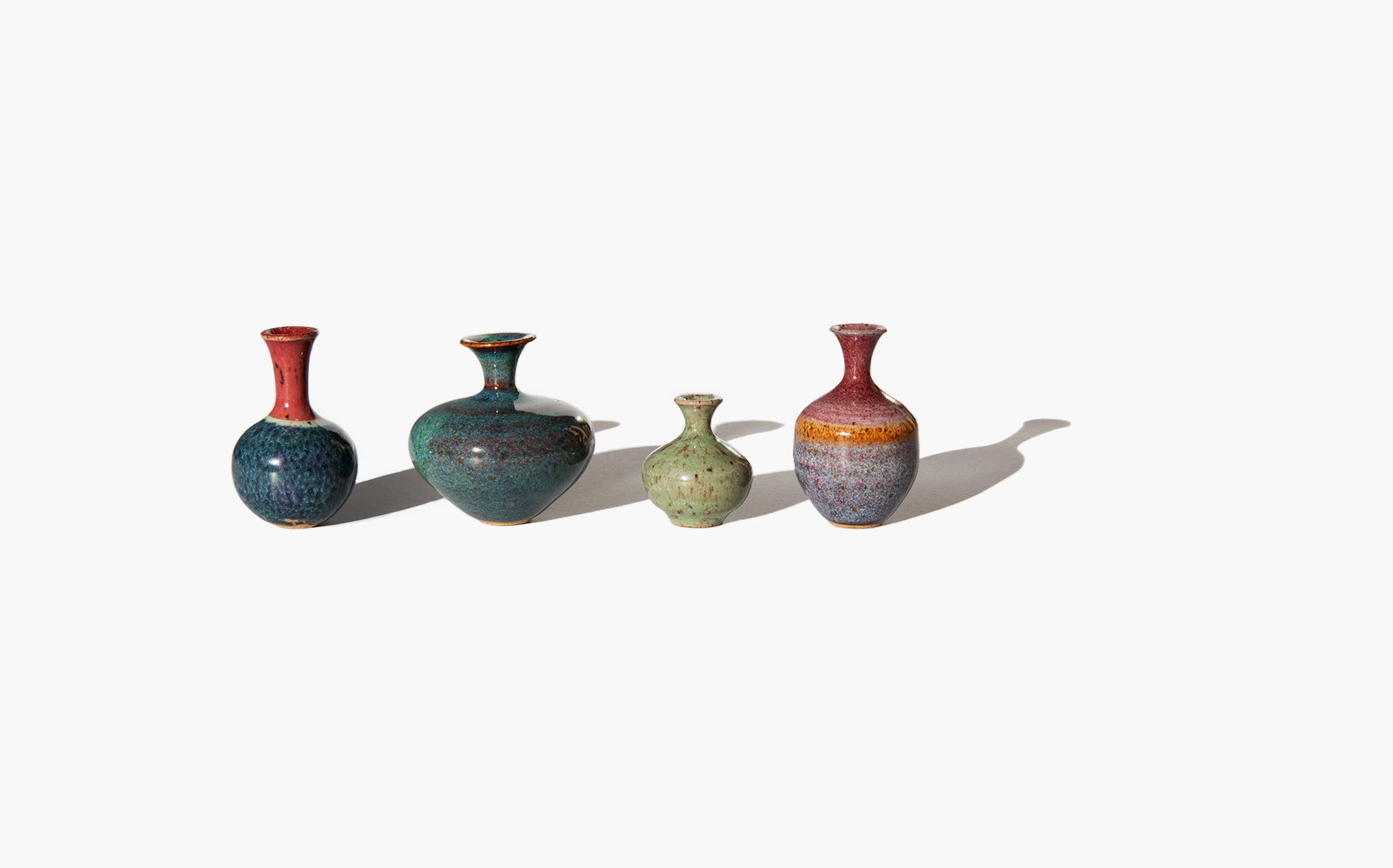 Set of Four Tiny Ceramic Urns