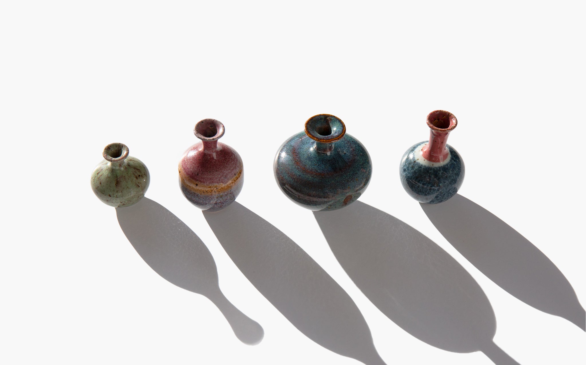 Set of Four Tiny Ceramic Urns